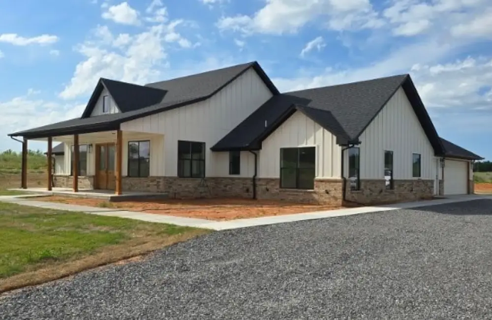 New custom home with stone and board-and-batten siding built by Richardson Homes