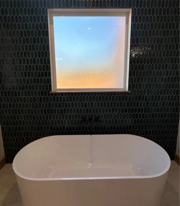 freestanding-tub-mosaic-tile-accent-wall-skylar Freestanding white bathtub with dark mosaic tile accent wall from a client project - Skylar